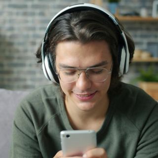 Person listening to an audiobook with headphones